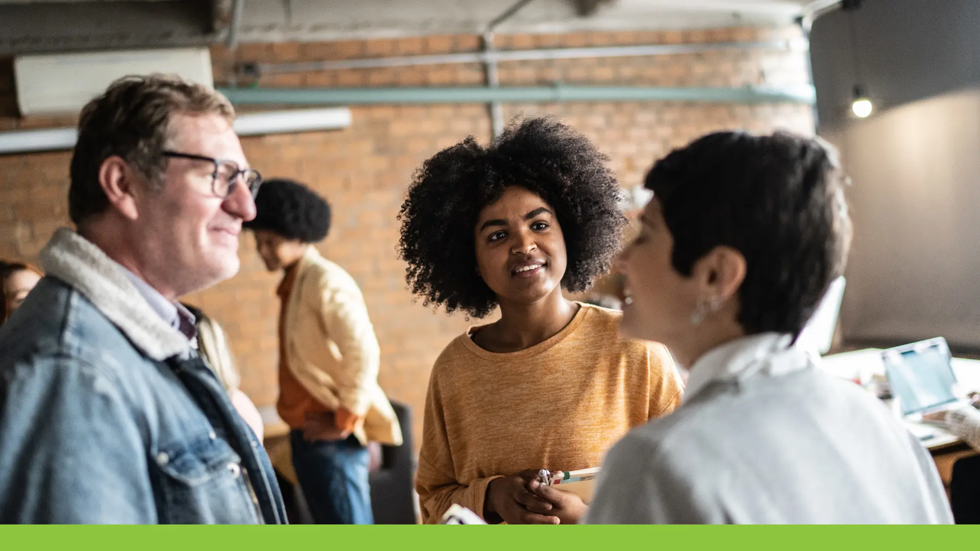 Group of diverse people in a meeting, smiling and talking
